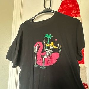 Skelton sitting on Flamingo Blow up